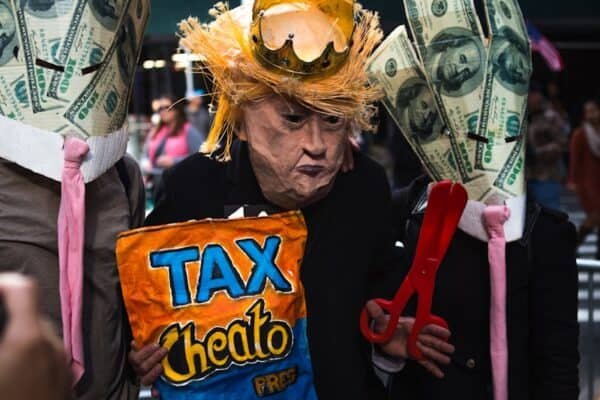 tilt shift lens photo of three men in costumes